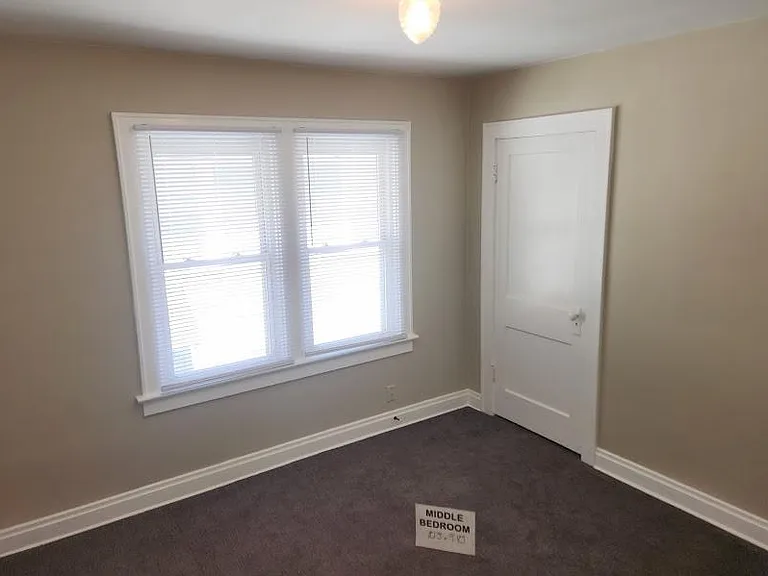 Middle bedroom, 10'5" x 9'10", new carpet, extra outlet installed, two windows, closet