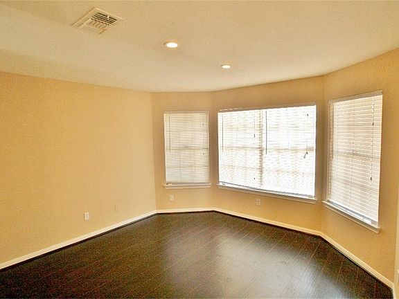 Formal Dining Room features a shallow bay window