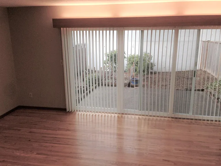 Large window wall to private fenced & secured backyard backy