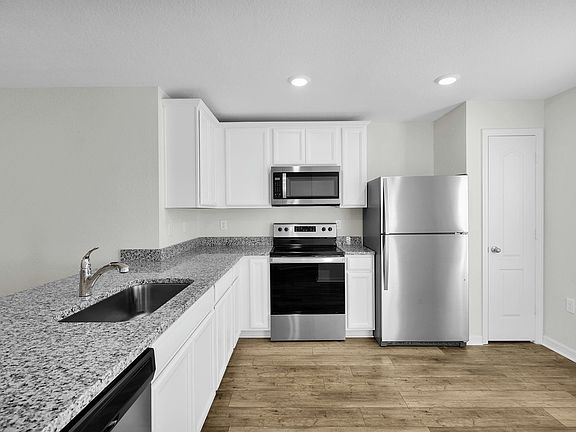 The kitchen comes chef ready with stainless steel appliances