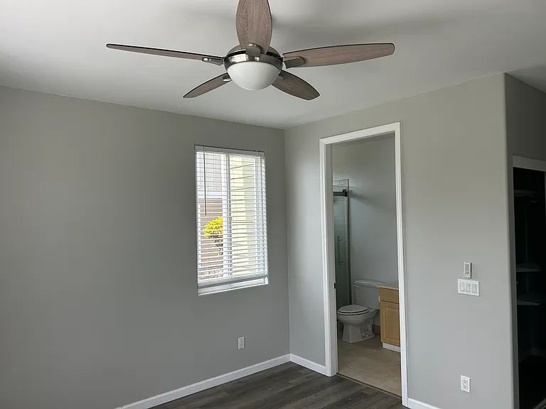 Master Bedroom towards bathroom and side window