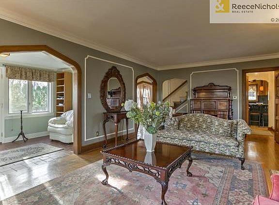 Wonderful walnut arches grace the room.  The sunroom is a great place for morning coffee or an afternoon nap.