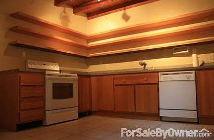 kitchen
						:
						Open shelving increases space. Built in cabinet is next to the refrigerator.