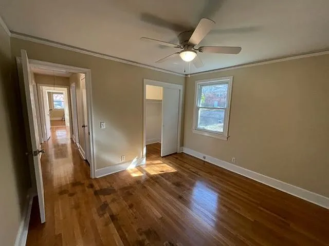 Second bedroom view of closet and hallway with large storage/coat closet.