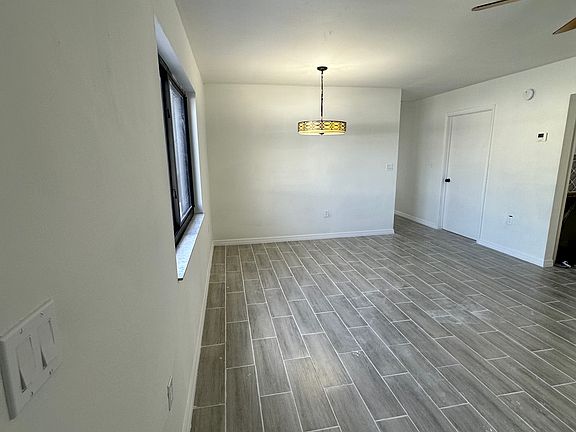 View of Dining Room with Beautiful Ceiling Lamp