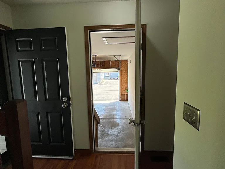 First floor hallway into attached 1 car garage