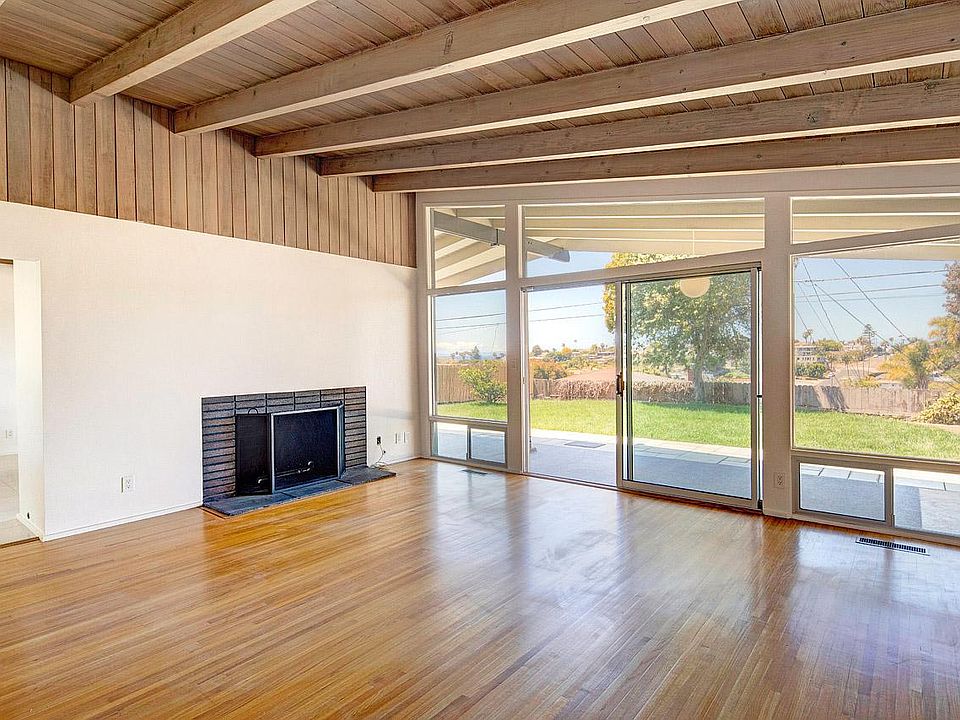 Gas fireplace in living room & doors to patio