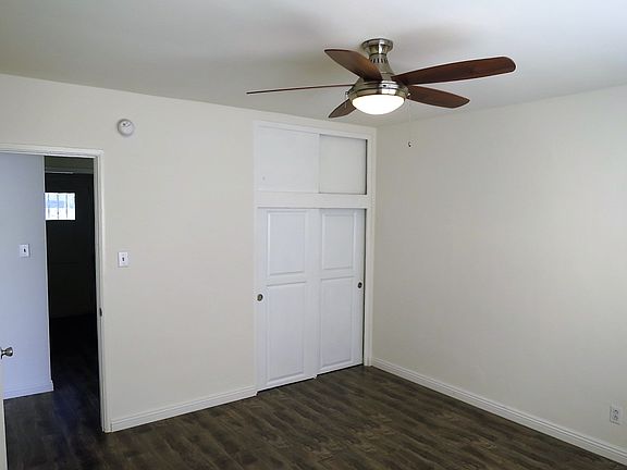 Bedroom with new closet door and ceiling fan