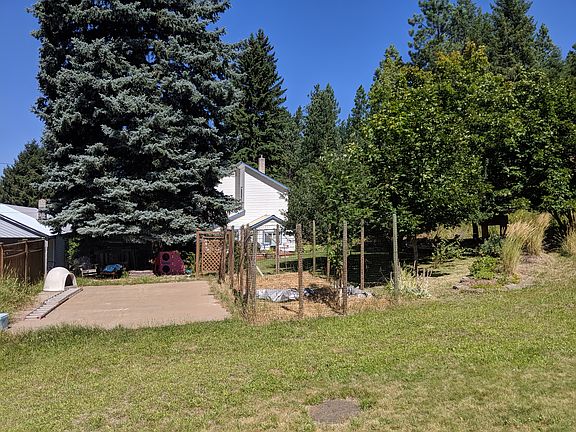 From alley, fenced garden