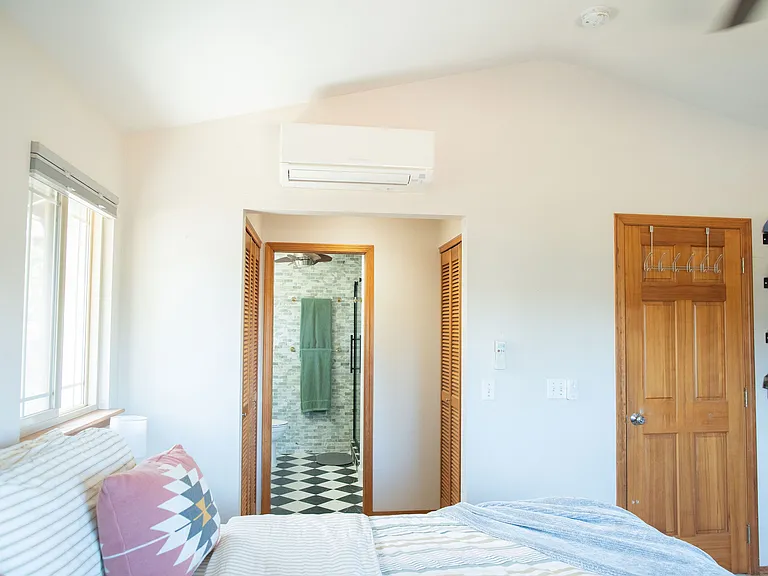 Primary bedroom, dual closets & bathroom
