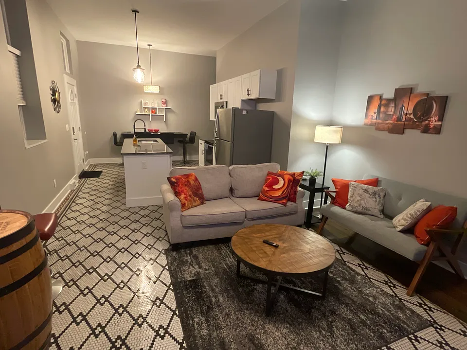 Open concept with the original tiled floor.