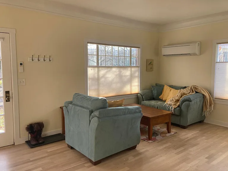 Comfy furniture and a ductless mini-split heat pump make the lounging spaces comfortable year-round.