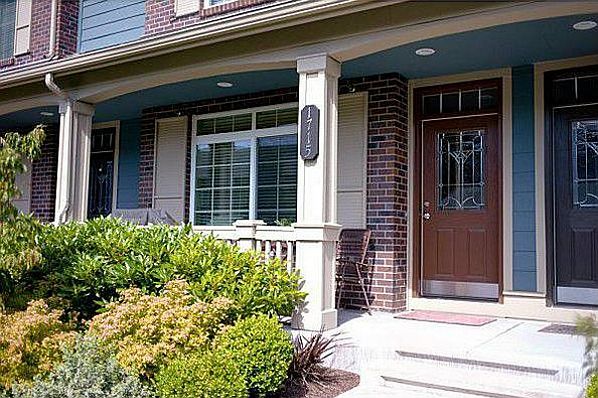 Front entry with porch and landscaped garden