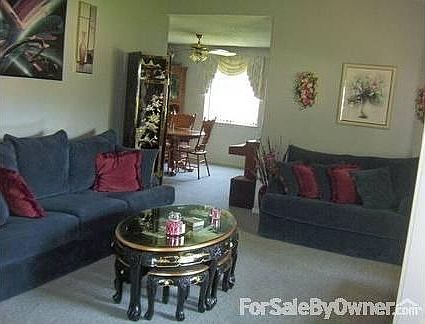 FORMAL LIVING ROOM
						:
						Formal living room w/vaulted ceiling looking into formal dining room.