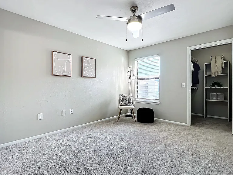 Enjoy the comfort and style of your cozy bedroom, featuring modern finishes, plush carpeting, and a spacious closet. Perfect for a restful night's sleep or a productive day.