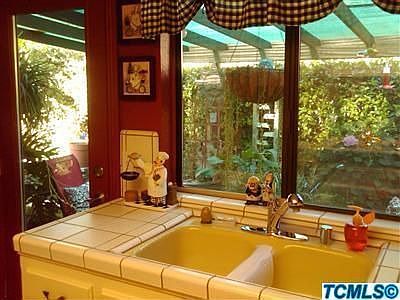 kitchen window looking into backyard