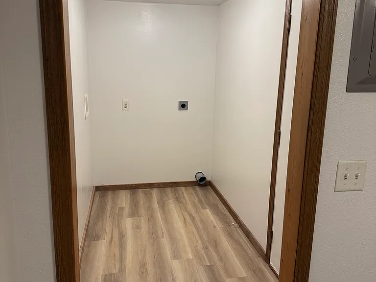 This wonderful laundry / storage room allows plenty of work space to complete those household tasks.