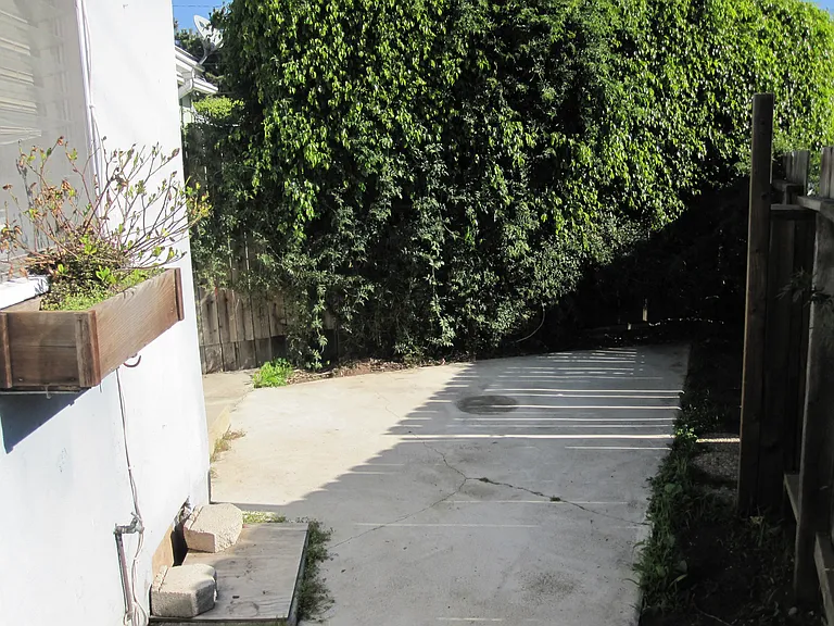 Backyard, with gate leading to the alley