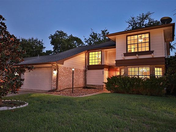 TONS OF LANDSCAPING FRONT AND BACK INCLUDING A ROCK ISLAND!