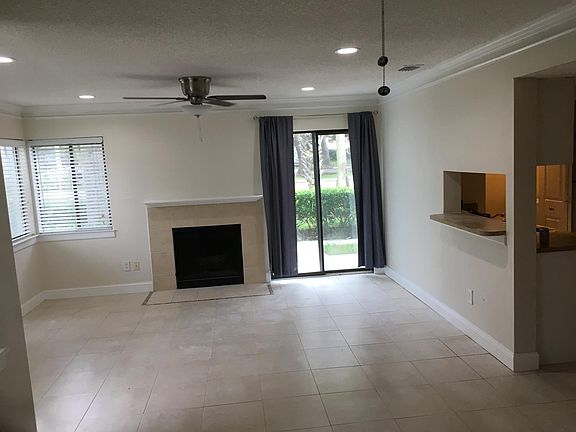 Living Room with Chimney and Patio door; new lighting and new super quiet ceiling fans