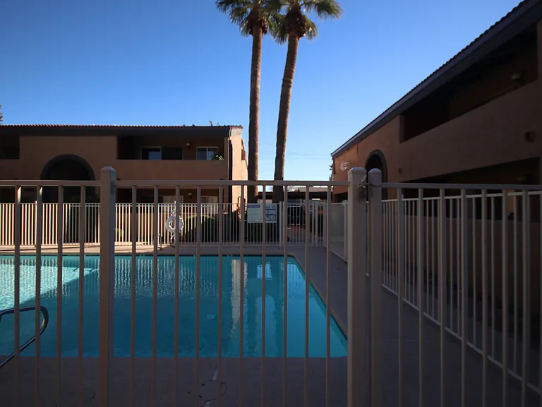 Joshua Square Condo Pool. Unit 2060A is in the building to your right-a quick dash to your door from the covered parking.