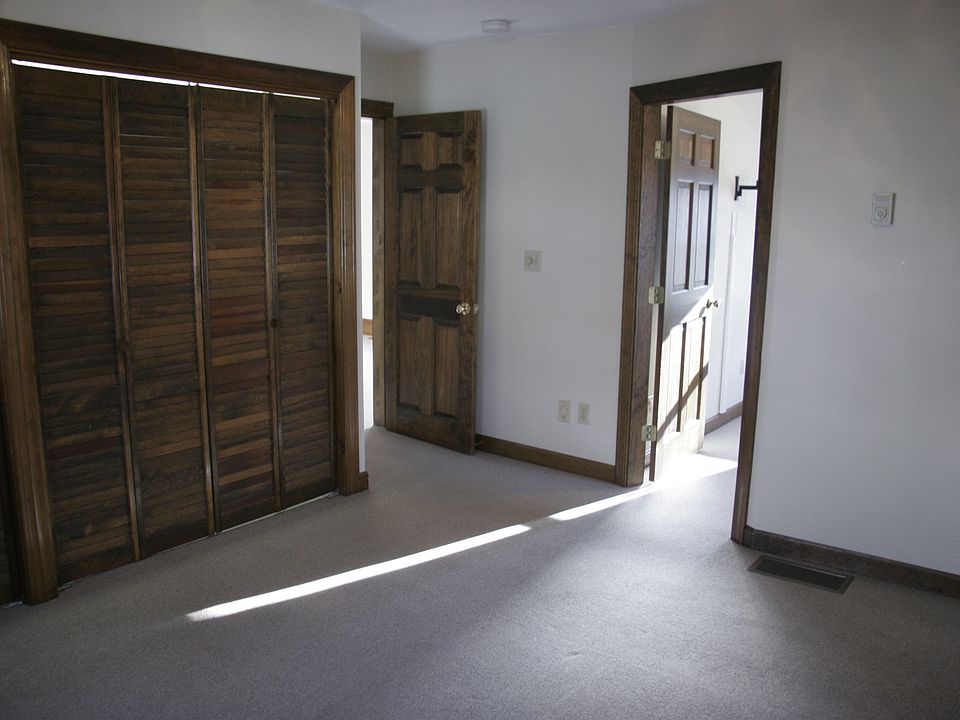 Standing in master bedroom looking towards 2nd bedroom