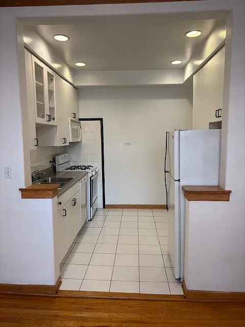 Full Kitchen, stove, refrigerator, dishwasher, microwave, designer cabinets.