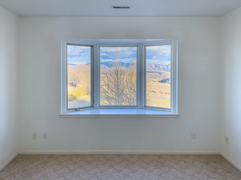 Upstairs bedroom #3 with bay window seat, perfect reading nook