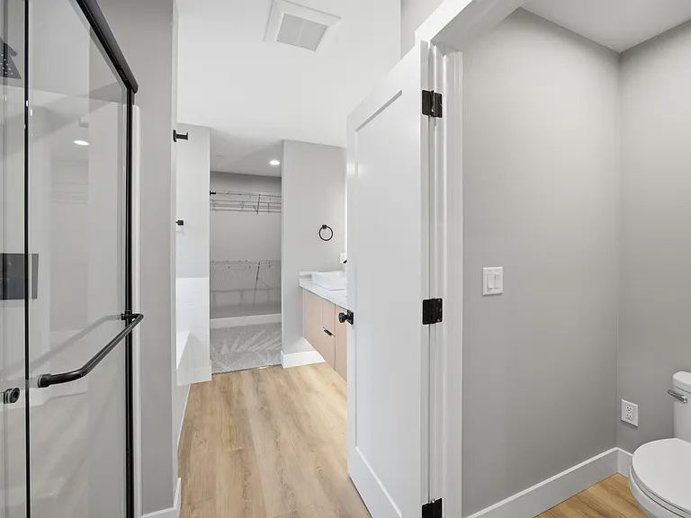 Master bathroom-Rain head shower. Lux soaker tub, his & hers vanity, large walk-in closet, private toilet with power for personal bidet option.