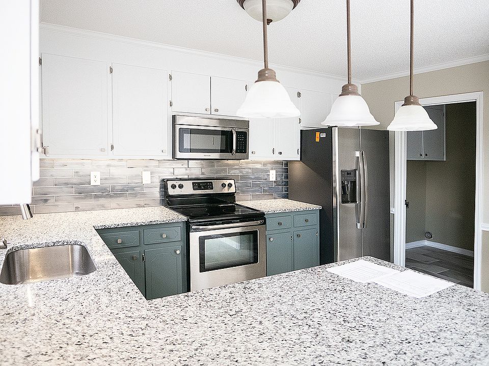 Expanded kitchen w/granite countertops, custom tile backsplash, under cabinet LED lighting, upgraded stainless steel appliances and laundry room