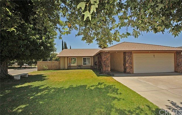 Single-story home on a corner lot with a 2 car attached garage
