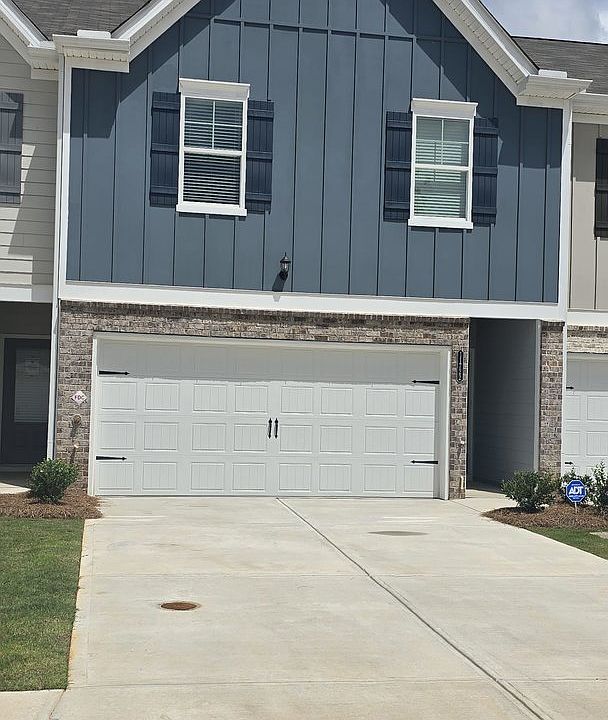 FRONT VIEW WITH DRIVE WAY TO 2 CAR GARAGE