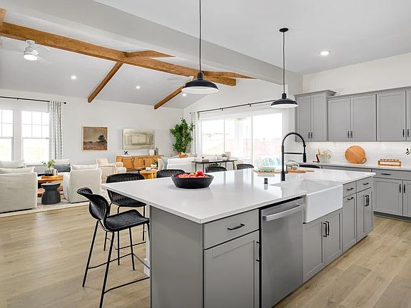 Kitchen with spacious island and white apron-front sink
