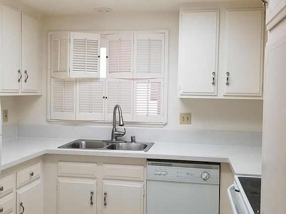 Kitchen with a brand new granite countertop, new sink and faucets, and plenty of storage