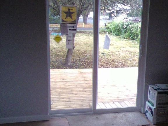 New sliding glass door and cedar deck