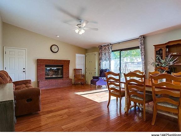 Family room with wood burning fireplace.