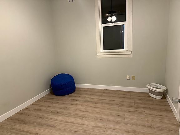 2520 W Franklin St. Another picture of the bdrm off of hall with walk in closet. New window, flooring, paint, ceiling fan.