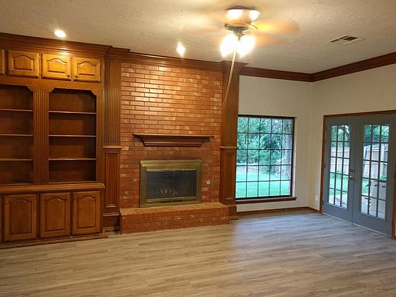 living room - french doors and wood fireplace with gas start