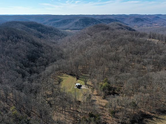 Aerial drone shot from the east side of the property looking west down the valley