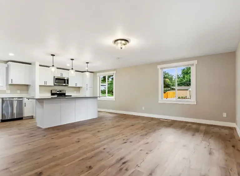 Open living room and kitchen with large island.