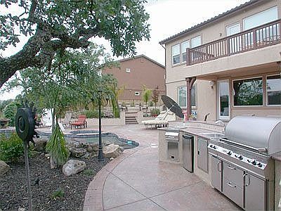 Gourmet outdoor kitchen, granite, seats 10