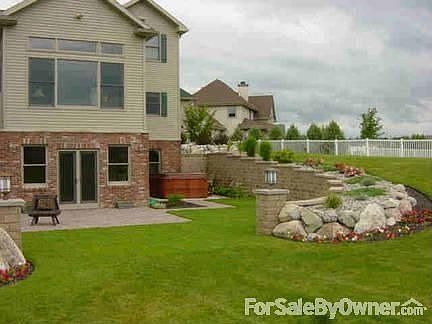 Rear of Home w/Full Walk-out Basement
						:
						French Doors Lead to Large Paver Stone Patio & Hot Tub
