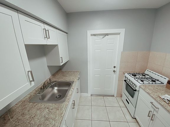 Kitchen w/ second entrance