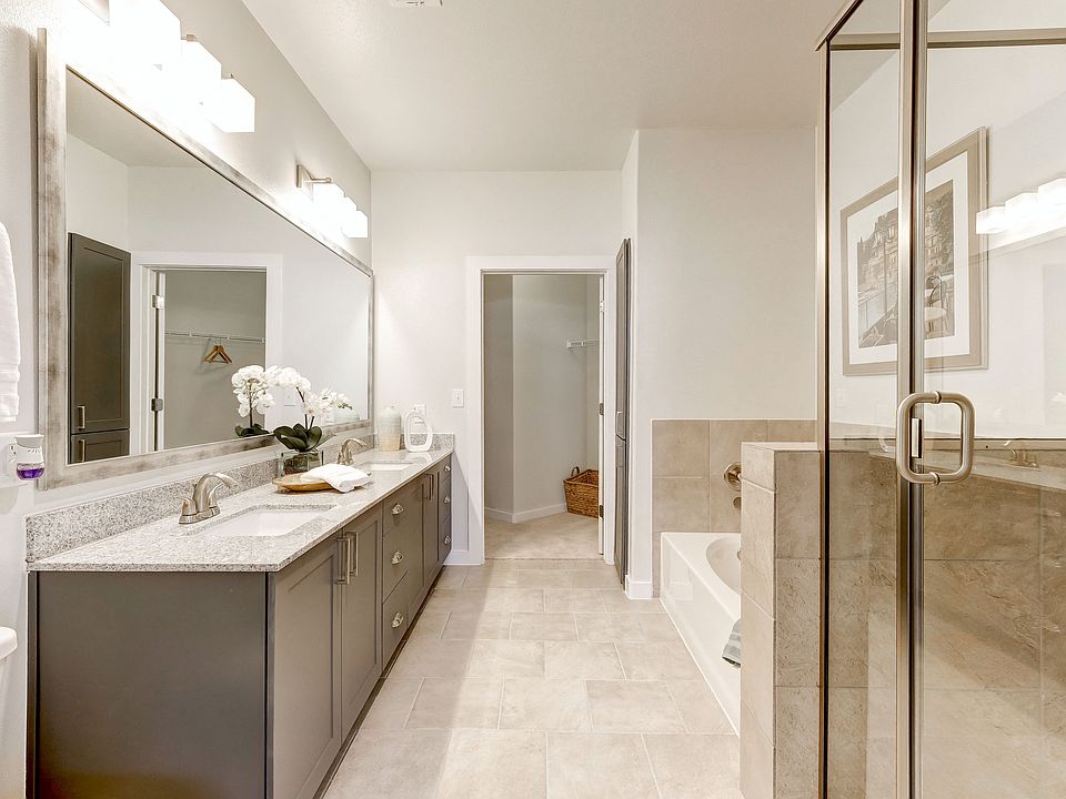 Double vanity bathroom with garden tub and standing shower