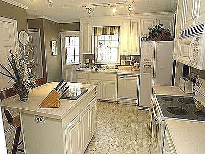 Kitchen with corrian countertops