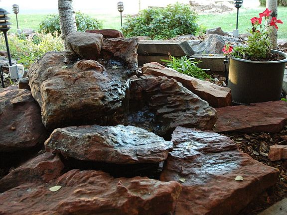 Trickling waterfall off the peaceful front porch.