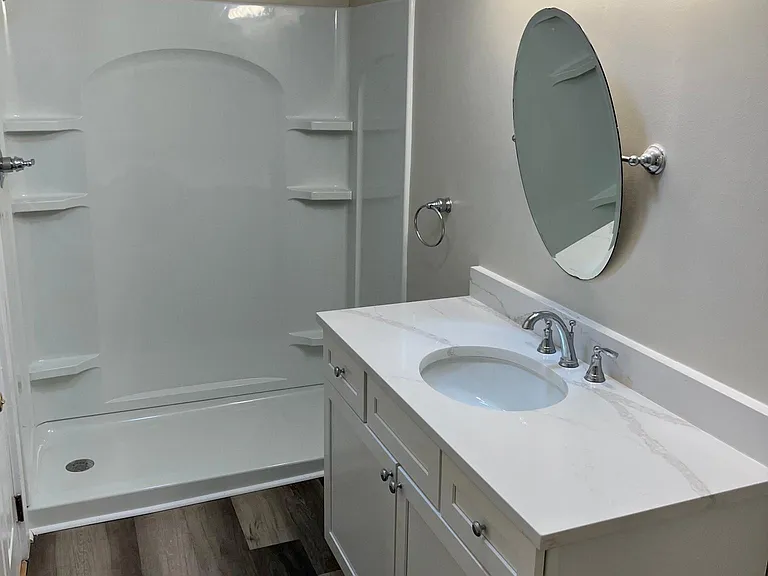 All new bathrooms; identical with granite countertops, new vanities, showers, toilets.