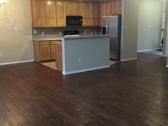 Living room opens to kitchen