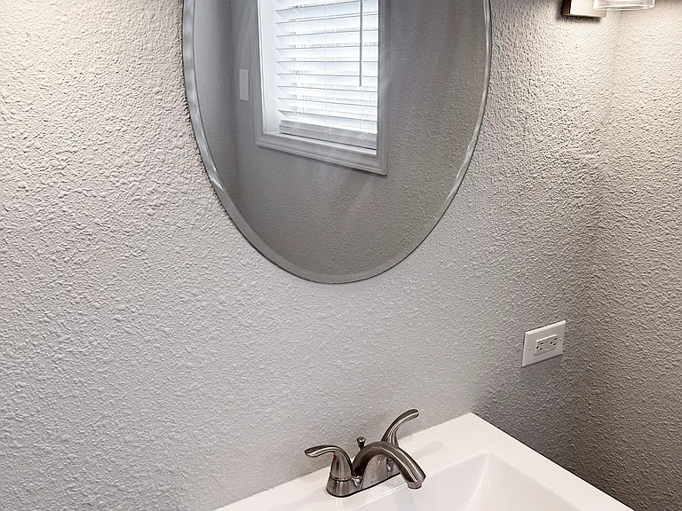 Bathroom Vanity/Sink area - new sink, cabinet and lighting fixtures.