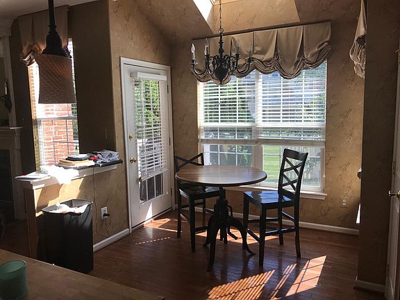 kitchen nook and door to back yard and small deck